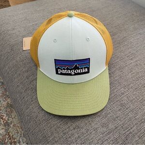 Patagonia Trucker Hat. Light blue, orange and green accents. NEW.